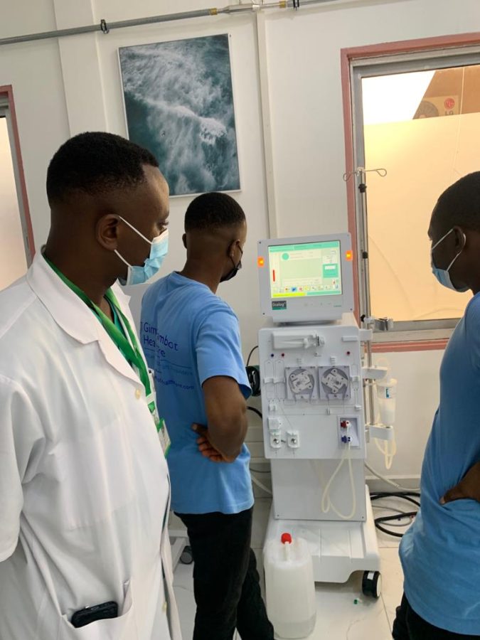 Gima-Bambot trainer and hospital staff learning to operate a hemodialysis machine at Hôpital Général de Douala