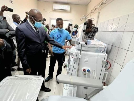Gima-Bambot technician presenting a dialysis machine to an official during the inauguration of the Bafoussam hemodialysis centre